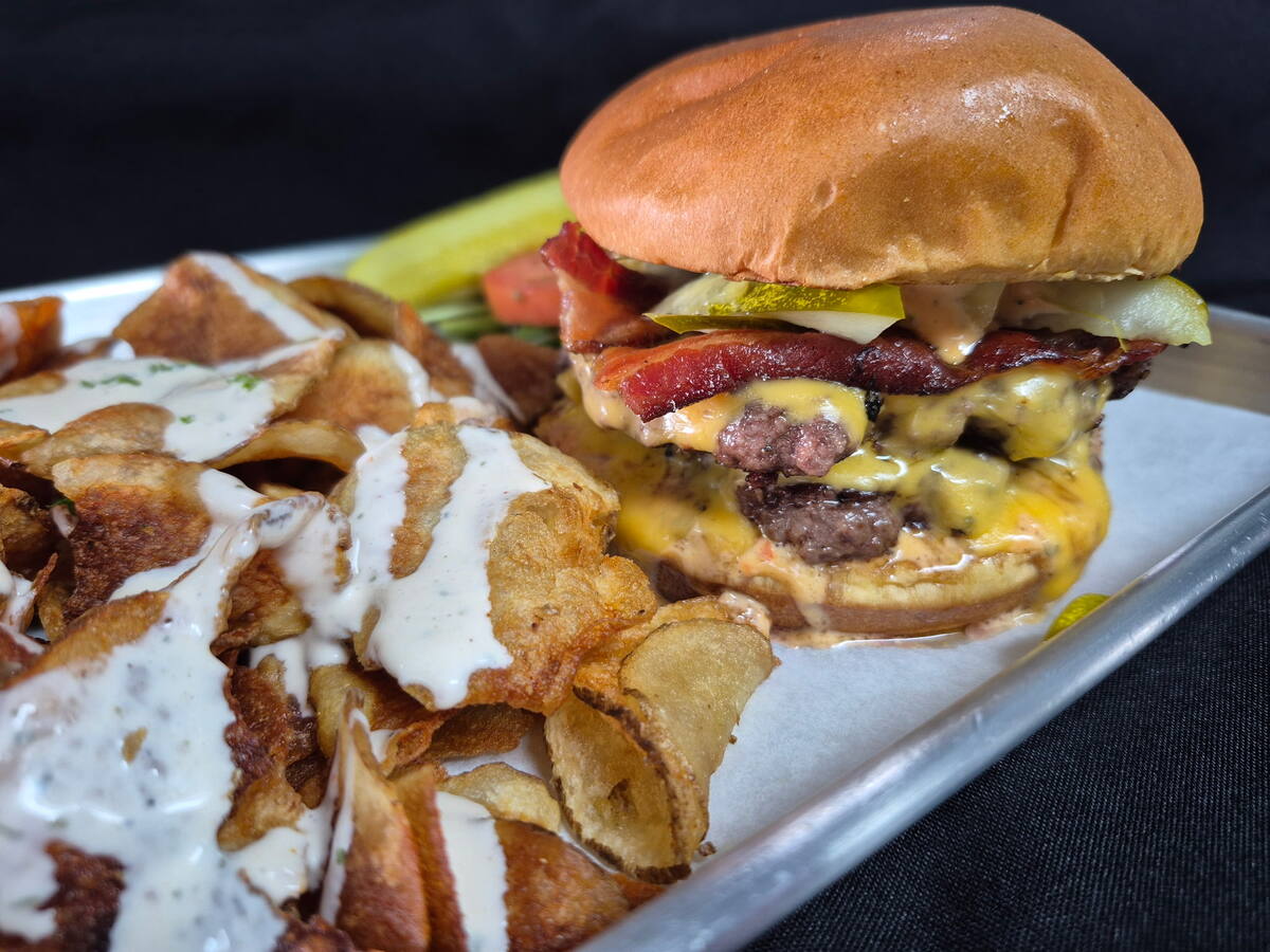 The Bodacious — double smash patties, American cheese, bacon, and shaved pickles on a brioche bun, with house chips