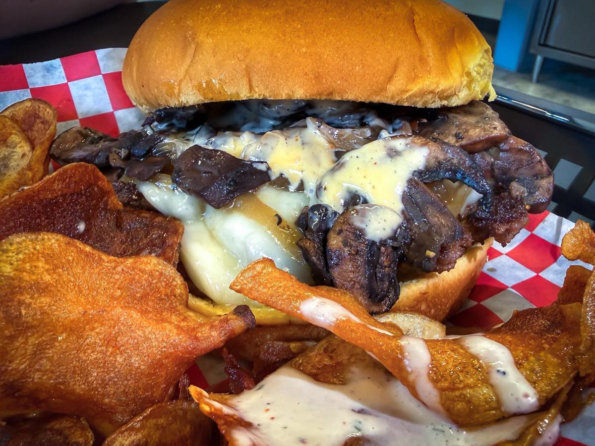 The Mushroom burger &mdash; melted Swiss, saut&eacute;ed mushrooms, and caramelized onion on a brioche bun, served with Tallow Chips